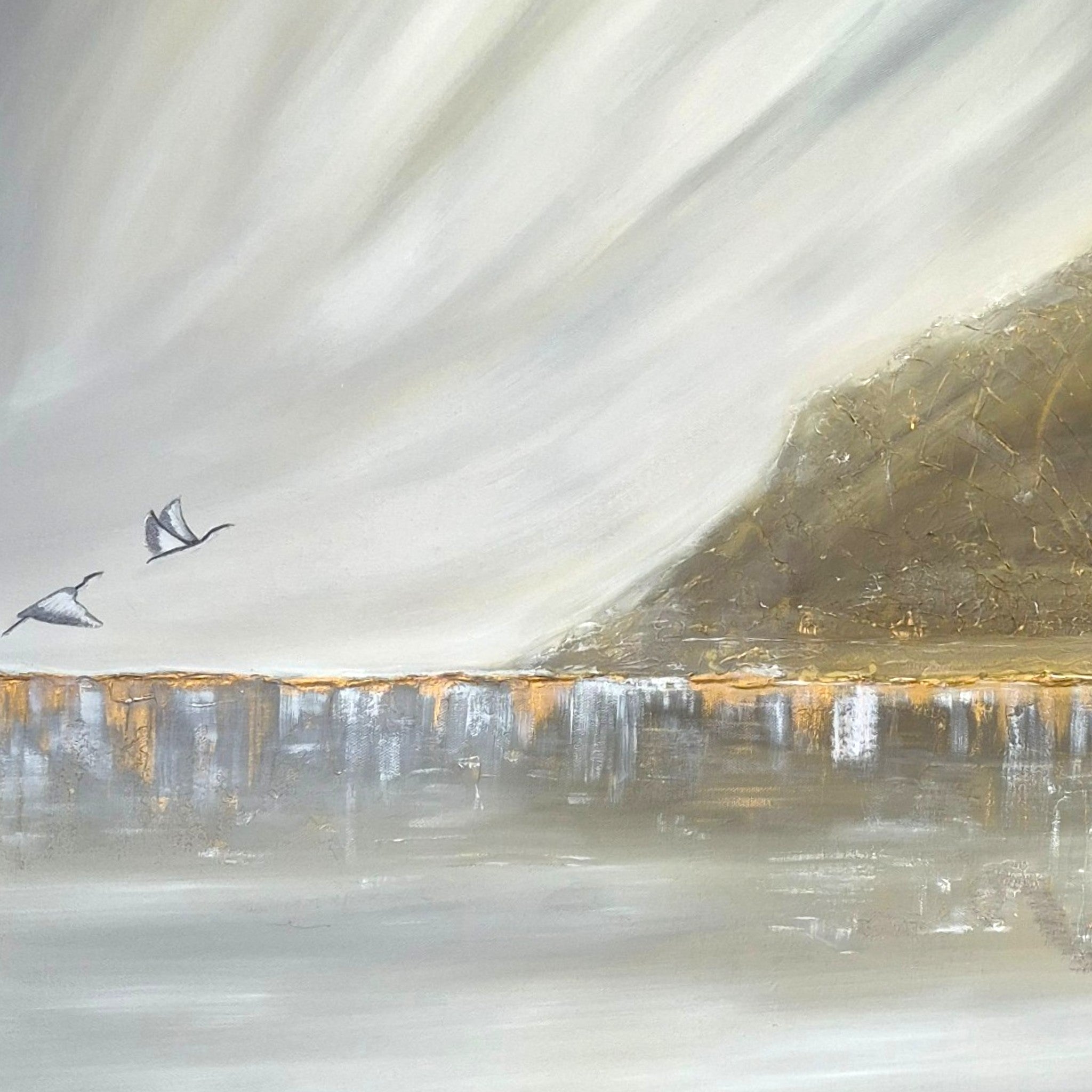 An abstract landscape painting featuring two flying birds, a textured hillside on the right, and a reflective body of water in soft gray, beige, and gold tones.