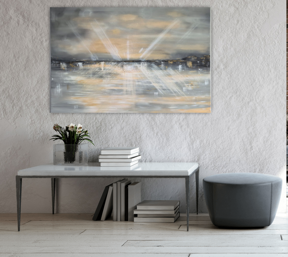 An abstract canvas painting with golden light rays over a dark cityscape hangs on a textured white wall above a modern console table with books, a vase of flowers, and a dark gray ottoman.